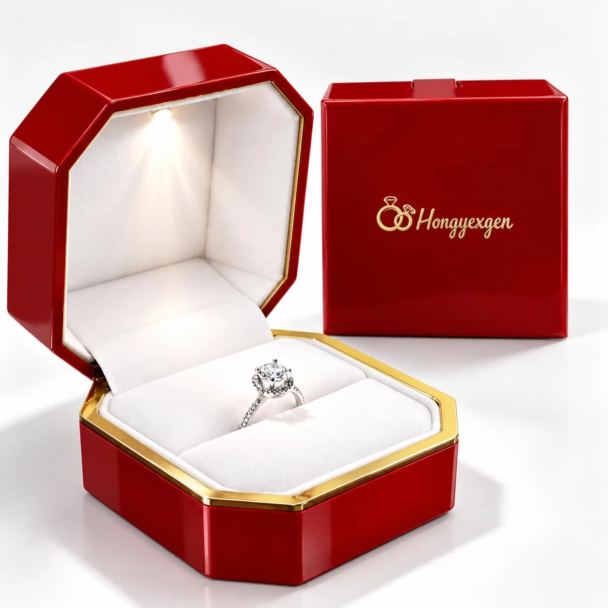 Red octagonal ring box open with the LED interior lit